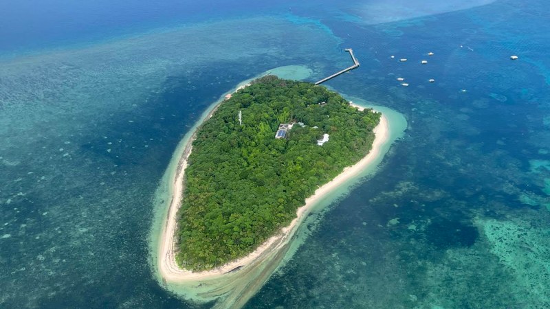 Green Island from the air — a small coral cay with a jetty on the Great Barrier Reef