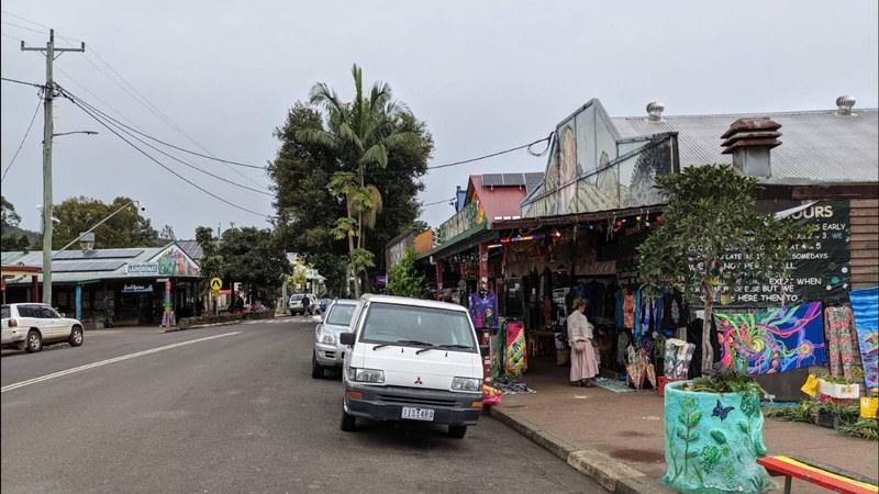 Nimbin main street with tie-dye shopfronts and painted murals