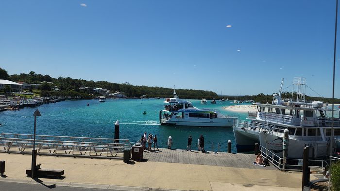 Jervis Bay expedition boat and sea cliffs south of Sydney